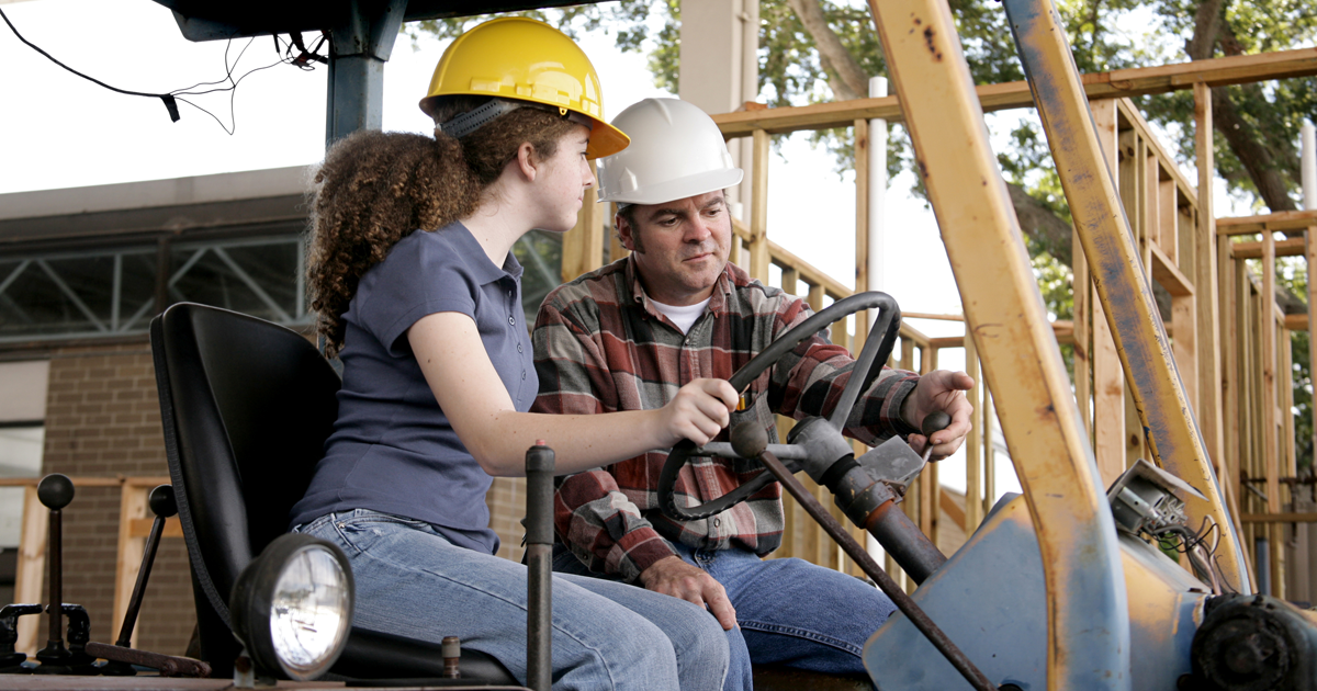 Instructor teaching proper use of machine