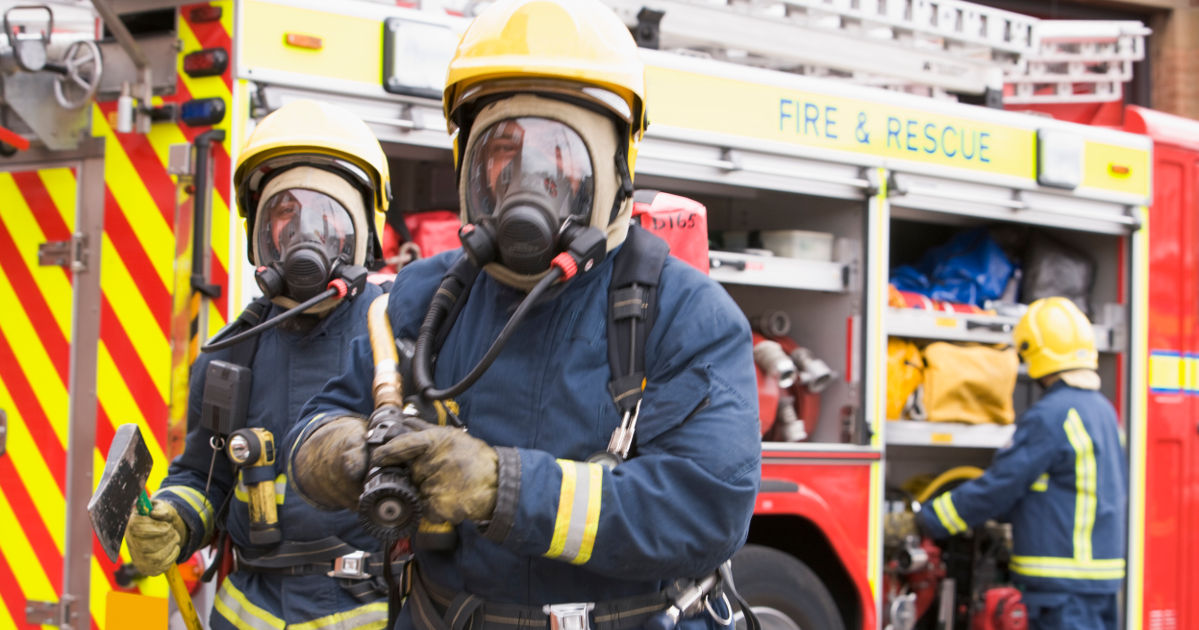 Firemen in front of fire truck