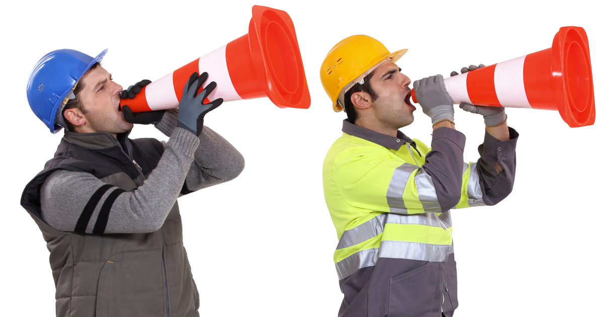 employees shouting through road cones