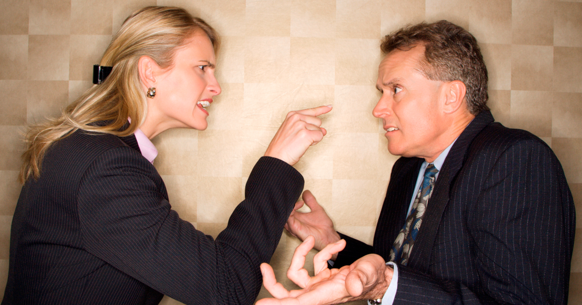 woman bullying man in workplace