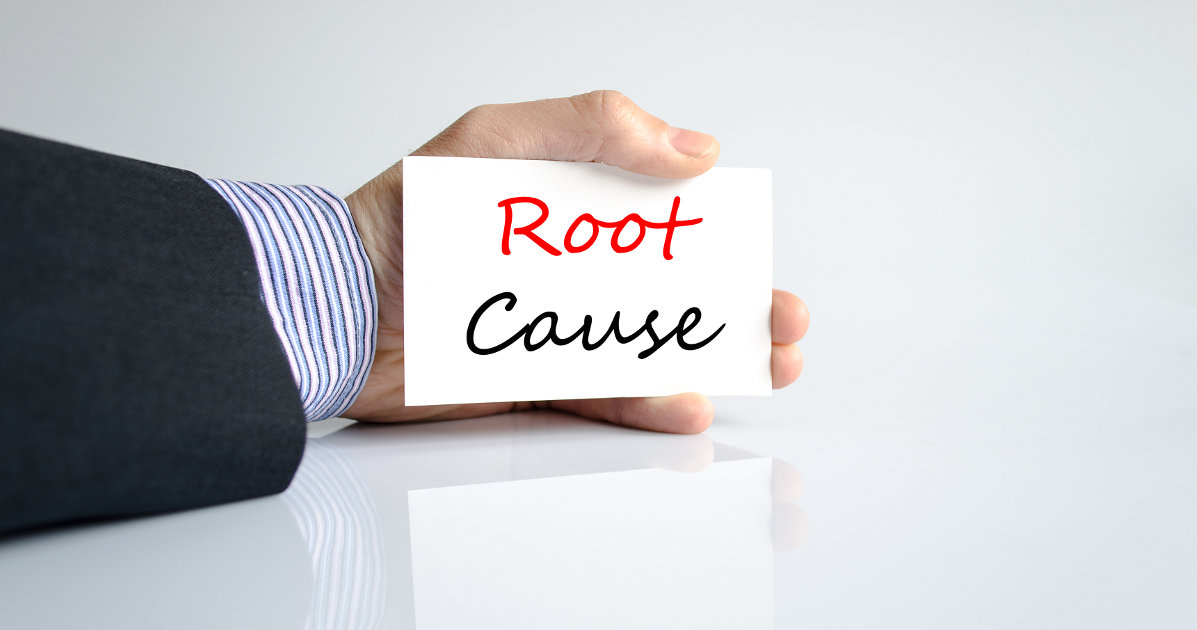 hand holding card that says root cause