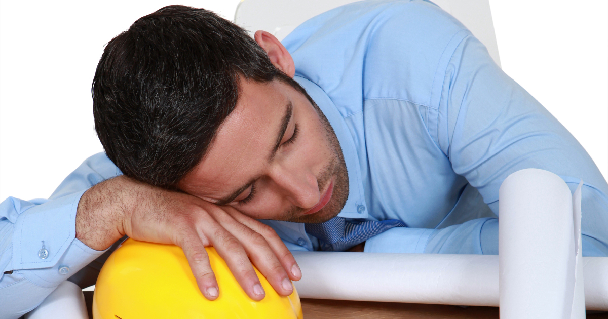 man sleeping on hardhat